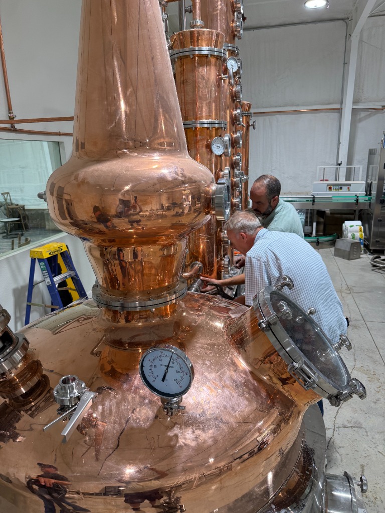 Distillers working on the copper still